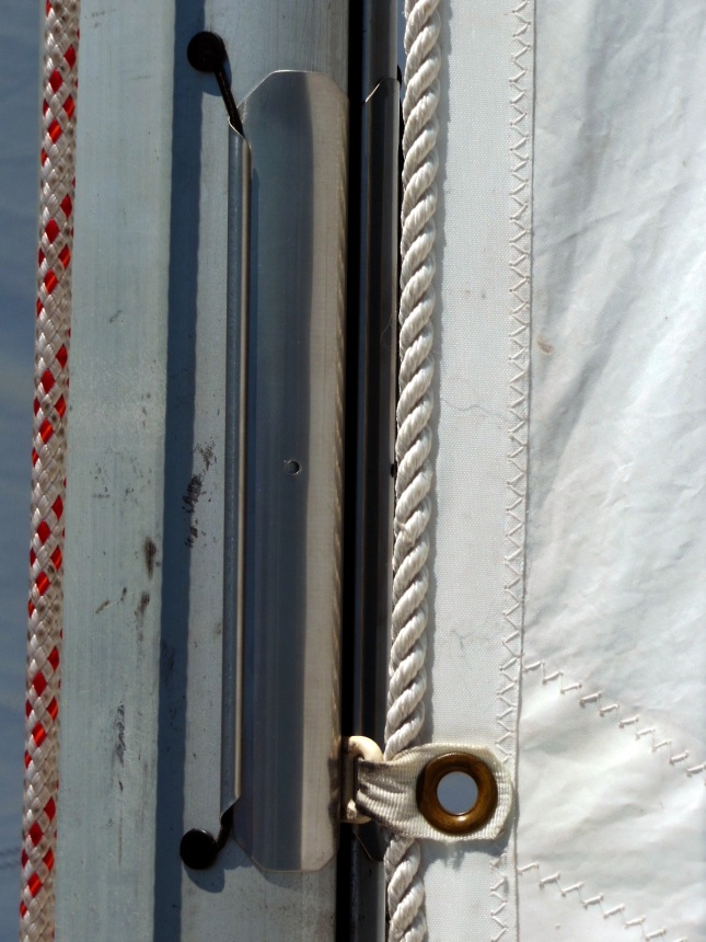Close-up of external hinged mast gates attached by shock cord