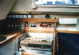 Above galley storage and a tamer stove